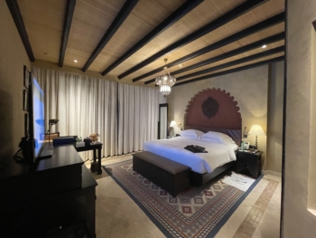 Qasr Al Sarab Desert Resort by Anantara - Deluxe Room with Balcony - Bed & Living - 01